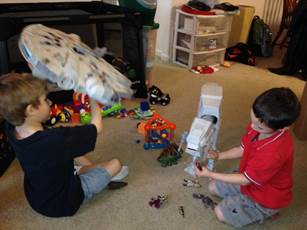 A couple of kids playing with toys

Description automatically generated with low confidence