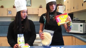 A couple of young women in chef hats

Description automatically generated