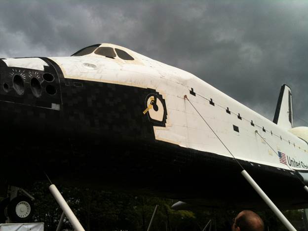 A space shuttle on display

Description automatically generated