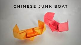 A couple of folded paper boats

Description automatically generated