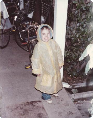 A child wearing a raincoat

Description automatically generated