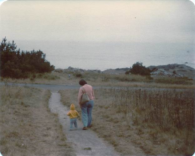 A person and child walking on a path

Description automatically generated