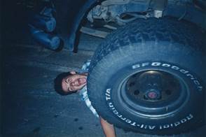 A person holding a tire

Description automatically generated with medium confidence