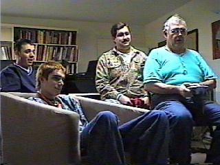 A group of men sitting in chairs

Description automatically generated