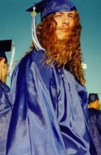 A person wearing a blue graduation gown

Description automatically generated