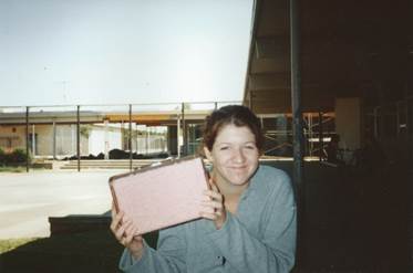 A person holding a pink case

Description automatically generated with low confidence