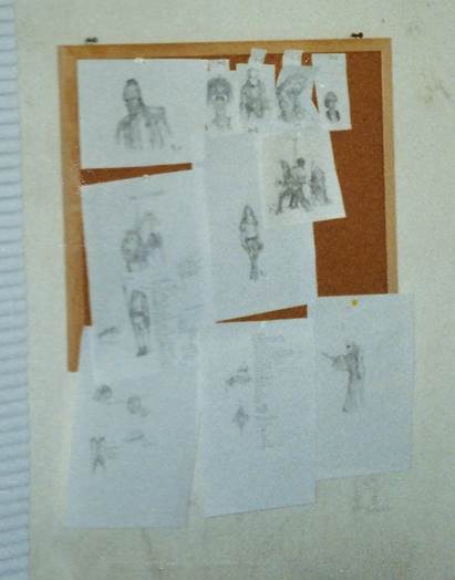 A group of drawings on a bulletin board

Description automatically generated