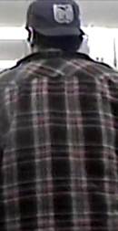 A back of a person wearing a plaid shirt

Description automatically generated