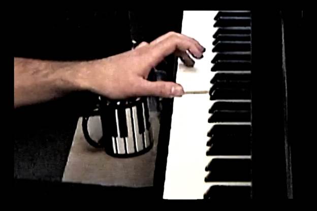 A person playing a piano

Description automatically generated with medium confidence