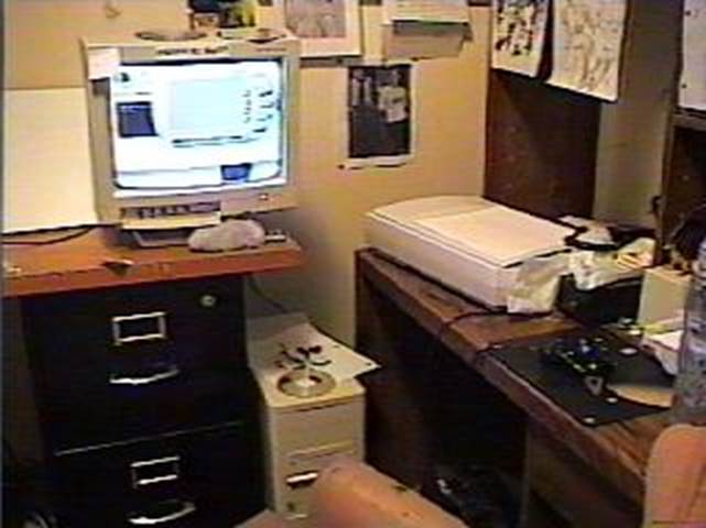 A computer on a desk

Description automatically generated with medium confidence