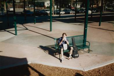 A person sitting on a bench

Description automatically generated with medium confidence