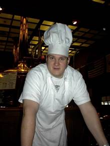 A person wearing a chef's hat

Description automatically generated with medium confidence