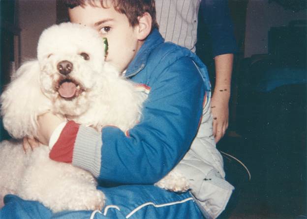 A boy and his poodle.
